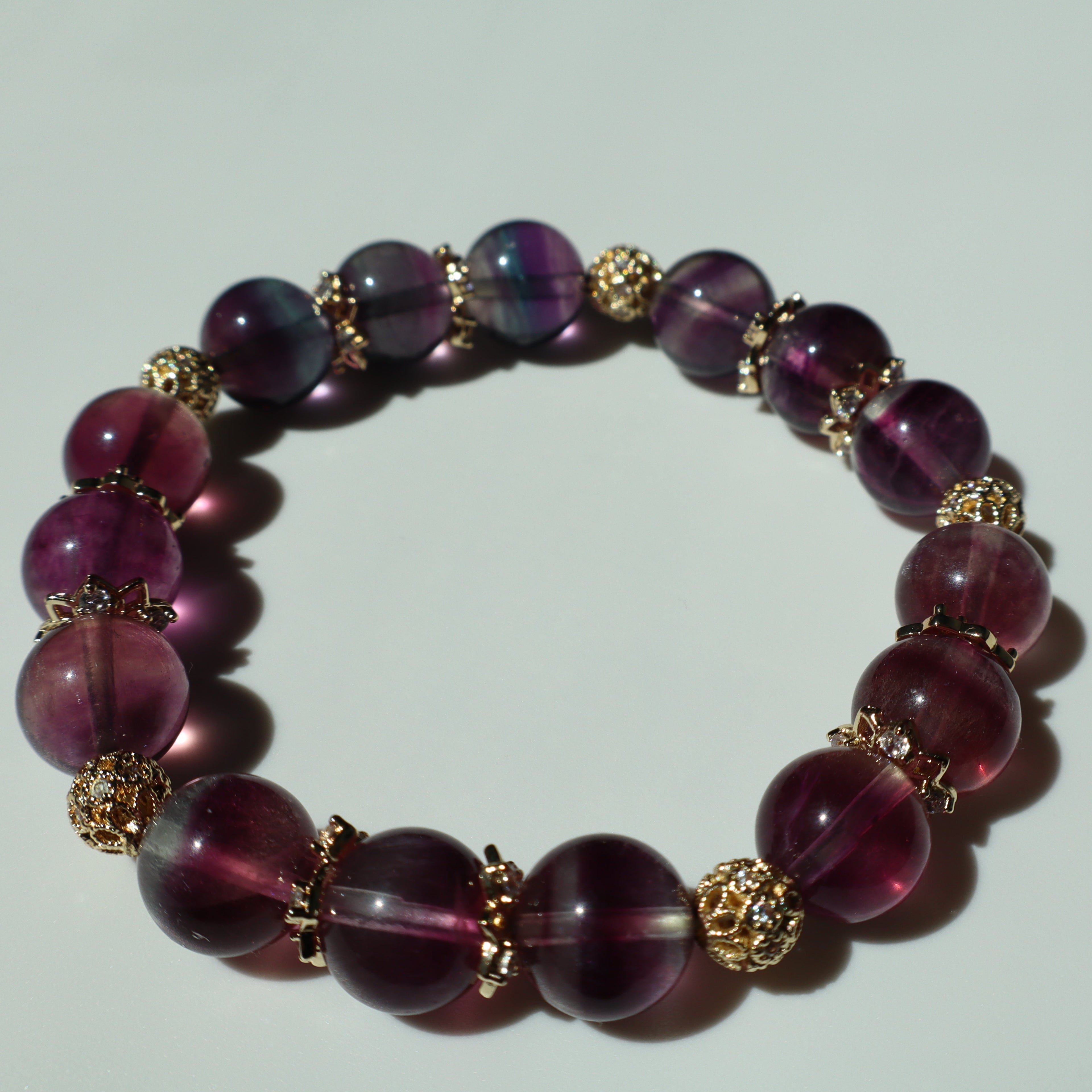 8mm Purple and Blue Rainbow Fluorite Bracelet with Gold Zircon Findings