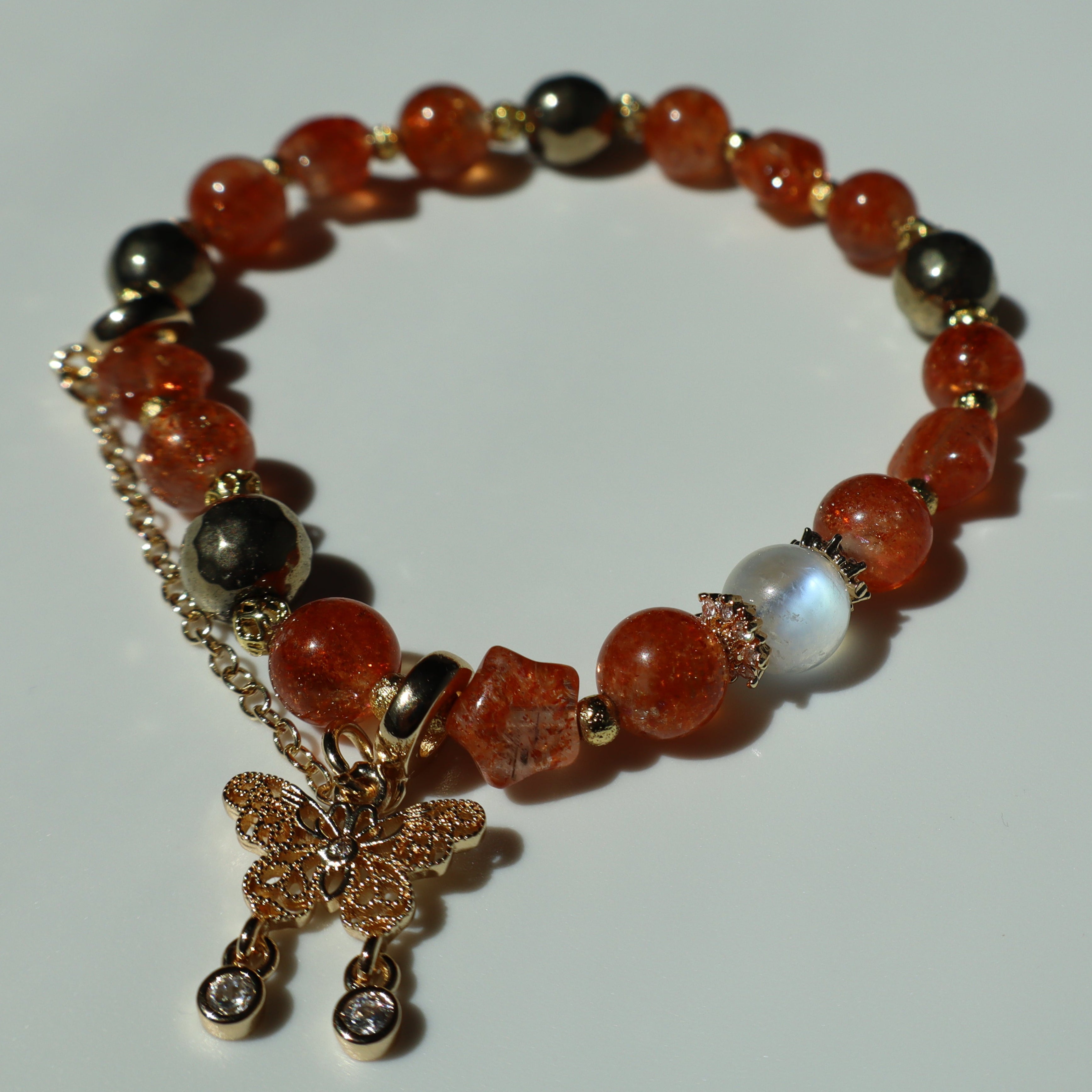 6mm Orange Star Shaped Sunstone Moonstone and Pyrite Bracelet with Gold Chain and Zircon Butterfly